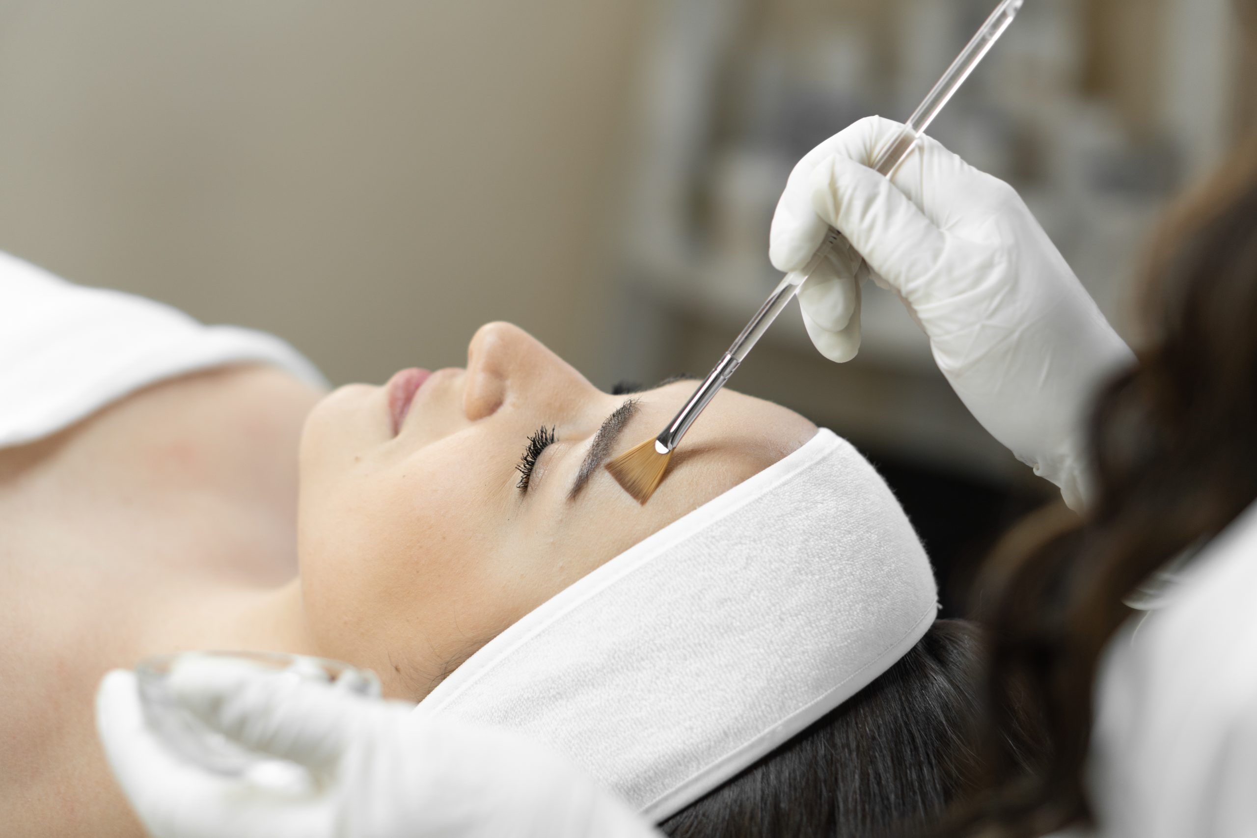 The photo reveals the magic of cosmetic peeling, where each stage of the procedure helps the skin young woman’s face to recover and renew. A beautiful patient in a beauty clinic is relaxed and resting The photo reveals the magic of cosmetic peeling, where each stage of the procedure helps the skin young woman’s face to recover and renew. A beautiful patient in a beauty clinic is relaxed and resting