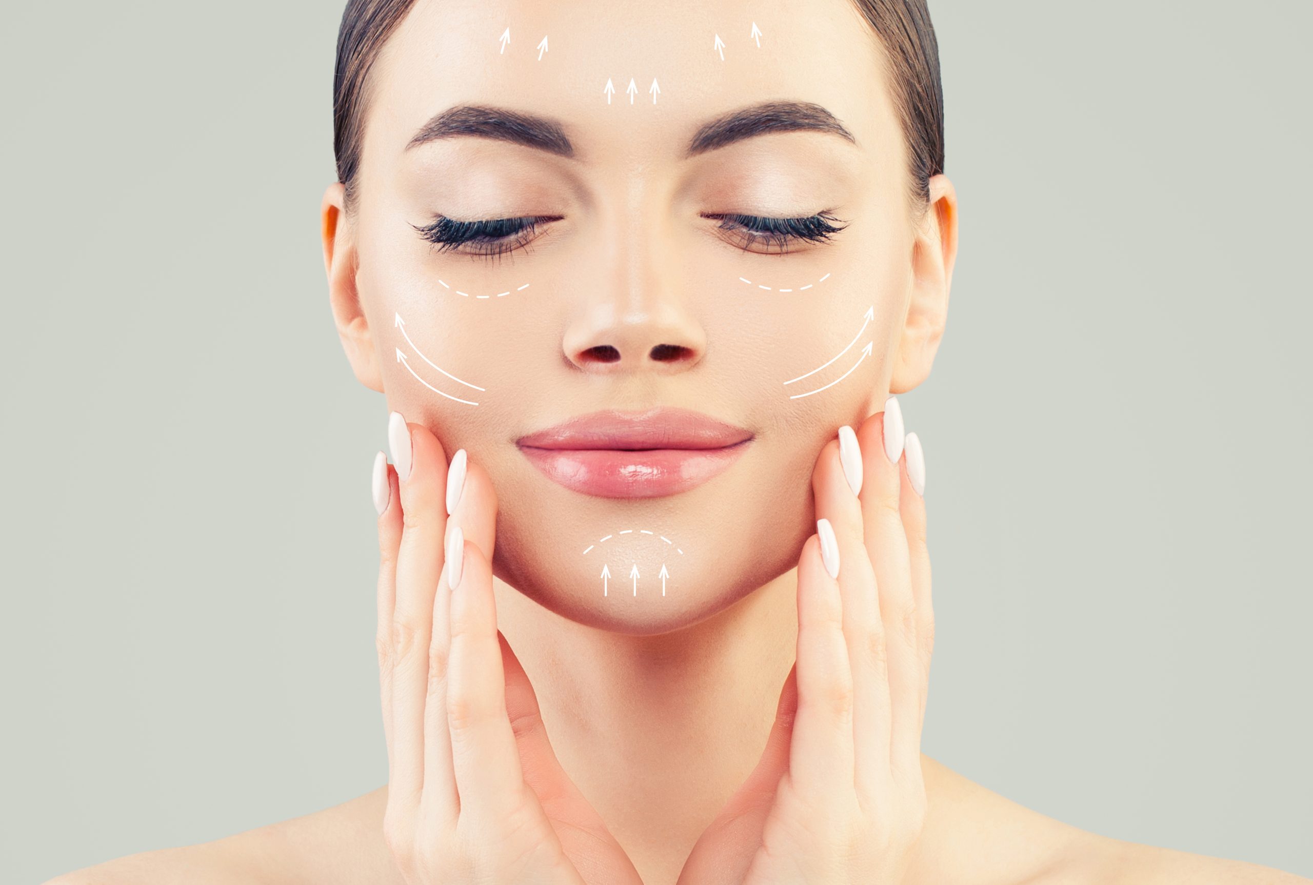 Graphic lines shows face lifting effect on young female face Graphic lines shows face lifting effect on young female face